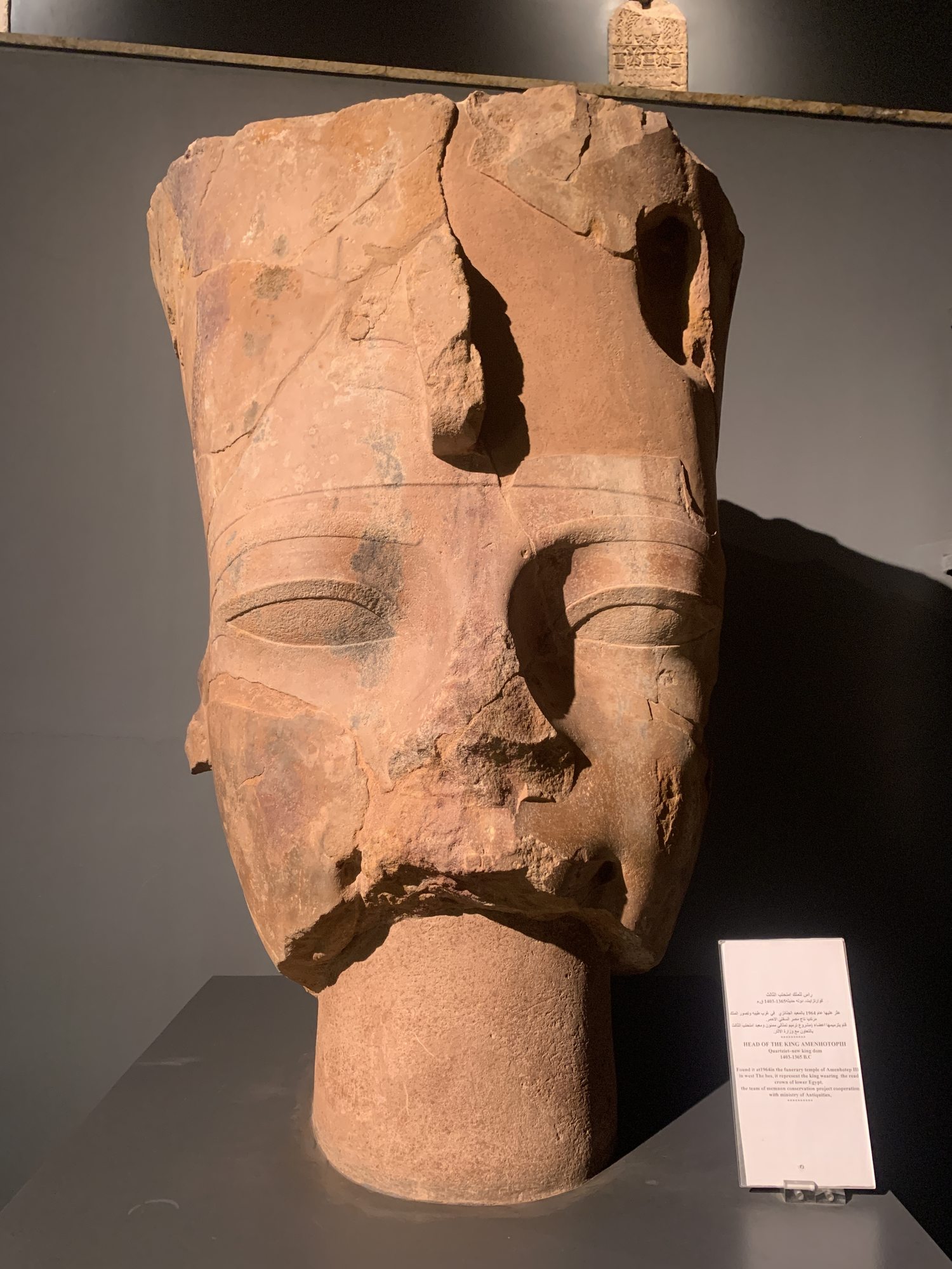 Quartzite head of Amenhotep III wearing the red crown in Luxor Museum
