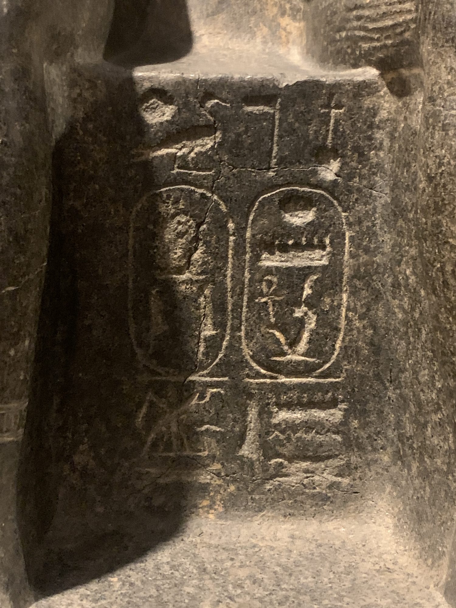 Double statue of Amun and Mut in Luxor Museum with their hands visible